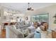 Bright and airy living room with hardwood floors, large windows, and an open floor plan at 4818 88Th E St, Bradenton, FL 34211