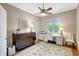 Bright office with stylish decor, custom built-ins, ceiling fan and a large window offering natural light at 4818 88Th E St, Bradenton, FL 34211