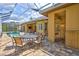 Screened pool area with a comfortable patio set, offering a perfect blend of relaxation and recreation at 4818 88Th E St, Bradenton, FL 34211