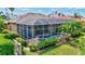 Relaxing screened-in pool area with lush landscaping and a peaceful outdoor setting at 4818 88Th E St, Bradenton, FL 34211