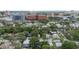Neighborhood aerial view showcasing charming homes nestled beneath a lush canopy of mature trees at 515 N Osprey Ave, Sarasota, FL 34236