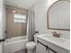 Well lit bathroom featuring a shower-tub combo with modern fixtures and classic tiling at 515 N Osprey Ave, Sarasota, FL 34236