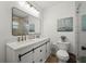 Elegant bathroom features a double vanity, modern mirror, and glass shower at 515 N Osprey Ave, Sarasota, FL 34236