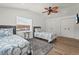 Bedroom with twin beds, wood floors, and matching décor at 515 N Osprey Ave, Sarasota, FL 34236