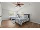 Bright bedroom featuring two twin beds, ceiling fan, and natural light at 515 N Osprey Ave, Sarasota, FL 34236