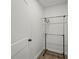 Empty closet with hanging rack and neutral tile flooring at 515 N Osprey Ave, Sarasota, FL 34236