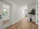 Bright hallway with wood floors and a plant in a stylish pot at 515 N Osprey Ave, Sarasota, FL 34236