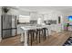Bright, renovated kitchen with a large island, stainless steel appliances, and sleek white cabinetry at 515 N Osprey Ave, Sarasota, FL 34236