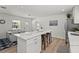 Recently updated kitchen with a large island, stainless steel appliances, and an adjacent dining area at 515 N Osprey Ave, Sarasota, FL 34236