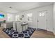 Bright open-concept living area with modern furnishings, wood-look floors, and plenty of natural light at 515 N Osprey Ave, Sarasota, FL 34236