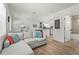 Open-concept living space showcasing modern decor, wood-look floors, and seamless flow to the kitchen at 515 N Osprey Ave, Sarasota, FL 34236