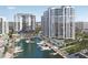 Beautiful waterfront view of the condominiums, marina, boat slips and pool area at 555 Quay Commons # 602, Sarasota, FL 34236