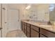 Bathroom featuring double sinks, granite countertops, and modern fixtures at 5968 Snowy Egret Dr, Sarasota, FL 34238