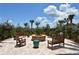 Cozy fire pit with seating, perfect for outdoor gatherings and relaxation at 5968 Snowy Egret Dr, Sarasota, FL 34238