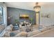 Comfortable living room features a stylish accent wall, contemporary decor, and ample natural light, creating an inviting atmosphere at 5968 Snowy Egret Dr, Sarasota, FL 34238