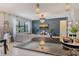 Open-concept living area with elegant decor, flowing into the kitchen and dining spaces, ideal for modern living at 5968 Snowy Egret Dr, Sarasota, FL 34238