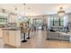 Open concept living space featuring the kitchen, dining area, and living room at 5968 Snowy Egret Dr, Sarasota, FL 34238