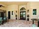 Inviting clubhouse lobby with elegant arched doorway and views of the pool area at 5968 Snowy Egret Dr, Sarasota, FL 34238