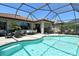 Spacious screened-in pool area featuring multiple seating zones and outdoor dining at 5968 Snowy Egret Dr, Sarasota, FL 34238