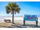Beautiful white sandy beach marked as Siesta Beach, perfect for relaxing under a clear blue sky at 6157 Midnight Pass Rd # E73, Sarasota, FL 34242