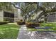 Beautiful condo complex with brick pavers and lush landscaping at 6157 Midnight Pass Rd # E73, Sarasota, FL 34242