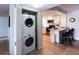 Convenient laundry area with a stacked washer and dryer at 6157 Midnight Pass Rd # E73, Sarasota, FL 34242