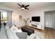 Modern living room with neutral decor and a ceiling fan at 6157 Midnight Pass Rd # E73, Sarasota, FL 34242