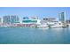 Picturesque marina featuring luxurious yachts docked near modern waterfront buildings at 6157 Midnight Pass Rd # E73, Sarasota, FL 34242