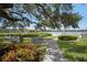 Scenic park featuring picnic tables, manicured lawns, and a picturesque waterfront view at 6157 Midnight Pass Rd # E73, Sarasota, FL 34242