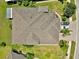 Aerial view of the house roof, landscaping and driveway with brick pavers at 635 Chipper Dr, Sun City Center, FL 33573