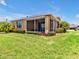 A cozy lanai offers the perfect space for outdoor relaxation and enjoyment at 635 Chipper Dr, Sun City Center, FL 33573