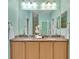 Elegant bathroom with double sinks, granite countertop, and neutral tones at 635 Chipper Dr, Sun City Center, FL 33573