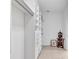 Bright walk-in closet features custom white shelving and drawers for optimal organization and storage at 635 Chipper Dr, Sun City Center, FL 33573