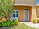 Charming entrance with decorative landscaping and two outdoor chairs for relaxation at 635 Chipper Dr, Sun City Center, FL 33573