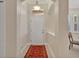Inviting foyer showcasing a stylish rug and neutral decor, leading to other rooms at 635 Chipper Dr, Sun City Center, FL 33573