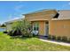 The front entrance is adorned with beautiful landscaping and outdoor seating at 635 Chipper Dr, Sun City Center, FL 33573