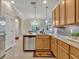 Spacious kitchen with a functional island, stainless steel appliances, and ample cabinetry at 635 Chipper Dr, Sun City Center, FL 33573