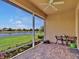Screened-in lanai offers scenic water views, creating an ideal outdoor relaxation and dining space at 635 Chipper Dr, Sun City Center, FL 33573