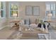 Inviting living room with a cozy couch, stylish tables, and a view to the garden at 635 Chipper Dr, Sun City Center, FL 33573