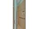 Modern shower with glass door, neutral tile, and accessible handrail at 635 Chipper Dr, Sun City Center, FL 33573