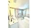 Bright bathroom showcasing double vanity, soaking tub, shower, white subway and modern hexagon tile at 6524 Senegal Palm Way, Apollo Beach, FL 33572