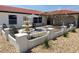 Enclosed courtyard with a fountain, shade tree, patio set, and decorative fencing at 6524 Senegal Palm Way, Apollo Beach, FL 33572