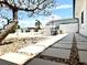 Stone tiled courtyard with decorative seating, fountain and shade tree at 6524 Senegal Palm Way, Apollo Beach, FL 33572
