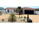 Charming single-story home with a red tile roof, lush landscaping, and a brick-paved driveway at 6524 Senegal Palm Way, Apollo Beach, FL 33572