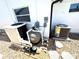 Exterior view of an HVAC system, water filtration and pump at 6524 Senegal Palm Way, Apollo Beach, FL 33572