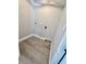 The laundry room features wood-look flooring and is ready for washer/dryer hookups at 6524 Senegal Palm Way, Apollo Beach, FL 33572
