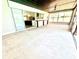 This screened in patio offers an excellent indoor/outdoor space with access to kitchen and covered ceiling with fan at 6524 Senegal Palm Way, Apollo Beach, FL 33572
