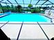 Enjoy the Florida weather in this screened-in pool with a view of canal at 6524 Senegal Palm Way, Apollo Beach, FL 33572