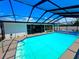 Beautiful pool with a screened-in enclosure and outdoor area at 6524 Senegal Palm Way, Apollo Beach, FL 33572
