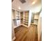 Large walk-in closet with plenty of shelving and space for organization at 6524 Senegal Palm Way, Apollo Beach, FL 33572
